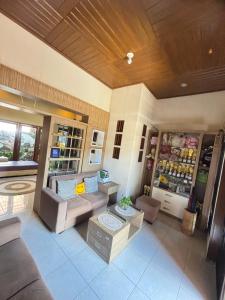 a living room with a couch and a table at Mocca Guest House in Banyuwangi