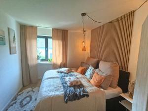 a bedroom with a bed with two dogs laying on it at EifelRuhe 5 - Platz für bis zu 8 Personen, Hunde willkommen in Schleiden