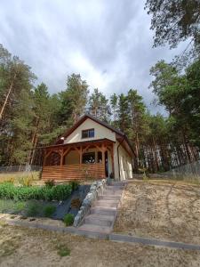 a small cabin in the middle of a forest at Jagódka Roztocze in Ulów