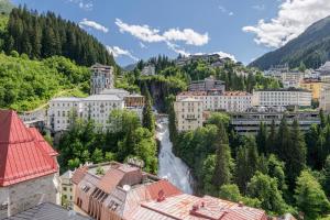 a view of a city with a waterfall at Residenz Boutique Suites in Bad Gastein