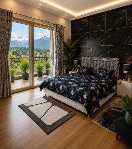 a bedroom with a large bed and a large window at SAAR Palampur Villa 5 BHK With Dhauladhaar Mountains View in Pālampur