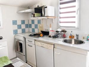 a kitchen with a sink and a counter top at L'Eden in Ansouis