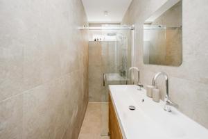 a bathroom with a sink and a shower at The Dune gate in Zandvoort +21 photos