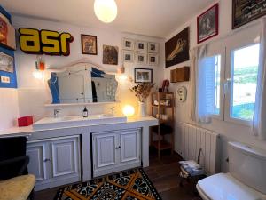 a bathroom with a sink and a mirror on the wall at Casa Roja Sigüenza in Sigüenza +43 photos