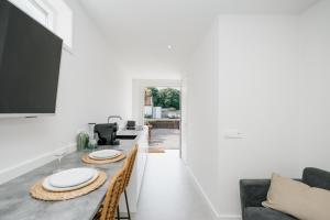a kitchen and dining room with a table and chairs at The Dune gate in Zandvoort