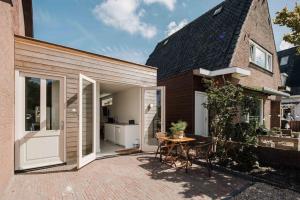 an extension to a house with a patio at The Dune gate in Zandvoort