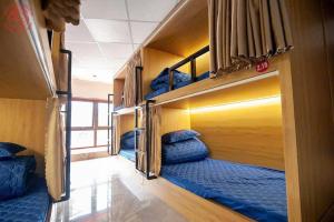 a group of bunk beds in a room at Ma Pi Leng Horizon Hostel - Tour & Motobike rental in Ha Giang