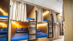 a group of four bunk beds in a room at Ma Pi Leng Horizon Hostel - Tour & Motobike rental in Ha Giang