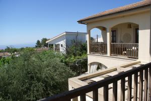 a view of a house with a balcony at Olive Tree House in Anoyira