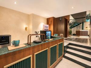 a kitchen with a counter with a coffee maker on it at Abode Jaipur in Jaipur