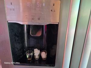 a microwave oven with three pairs of shoes in it at Royal hammock-Kralski hamak in Chernomorets
