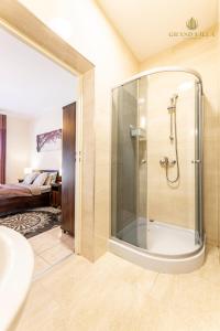 a bathroom with a shower and a sink at GRAND VILLA USTKA- POKOJE z BALKONAMI I TARASAMI, PARKING W CENIE ! in Ustka +105 photos
