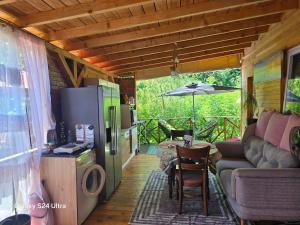 a living room with a couch and a table at Royal hammock-Kralski hamak in Chernomorets