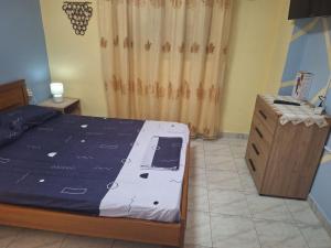 a bedroom with a bed and a dresser and a window at Vangel Garden in Agios Nikolaos +21 photos