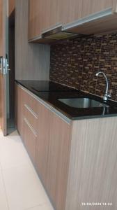 a kitchen with a sink and a counter at Nam Talay Condo Monthly only in Na Jomtien
