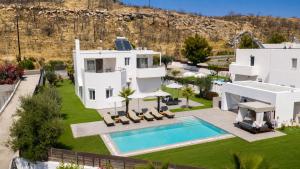 an aerial view of a villa with a swimming pool at Villa Marina - Glystra Beach in Kiotari