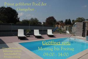 a magazine advert for a swimming pool with white lounge chairs at Balilounge 1 & Balilounge 2 in Haßloch