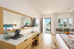 a kitchen with a counter and a sink in a room at Canary Kendwa Beach Resort in Kendwa