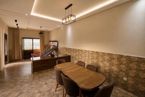 a dining room with a table and a piano at Villa privée avec piscine chauffée in Oulad Teïma +27 photos