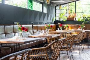 a row of tables and chairs in a restaurant at Budget Hotel Rooms In Yerevan in Yerevan