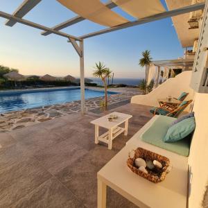 a villa with a view of the ocean at Bellevue Village ''Αdults Only'' in Agia Pelagia