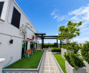 a view of the backyard of a house with a lawn at CONDO UNIT With BALCONY in Bangkok