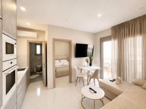 a living room with a couch and a table at AGORA luxury APARTMENT 3 in Loutraki +21 photos