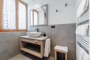 a bathroom with a sink and a mirror at Albergo Maggiorina in Ledro +59 photos