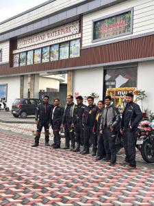 a group of men standing in front of a store at Apni Haveli Hotel and Restuarant in Bhojpur