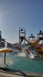 a water park with a slide in the water at Apni Haveli Hotel and Restuarant in Bhojpur