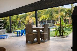a table and chairs sitting on a patio at Salt and stone in Cape Town