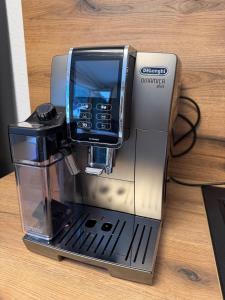 a coffee machine sitting on top of a table at Ferienwohnung Hopfentraum in Alpirsbach +7 photos