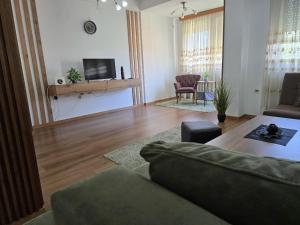 a living room with a couch and a table at Eva apartment in Ohrid