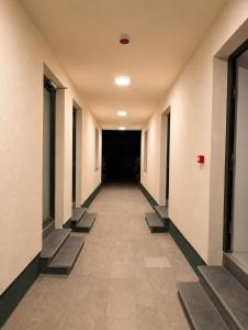 a corridor of an empty hallway in a building at Maison Bruxelles in Brussels