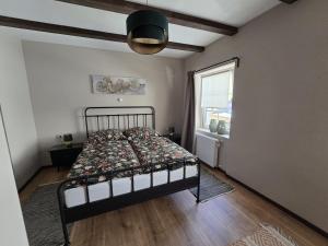 a bedroom with a bed and a window at Excellent house in Ediger-Eller