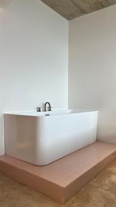 a bathroom with a white sink in a room at Kartuli Hotel in Batumi +92 photos