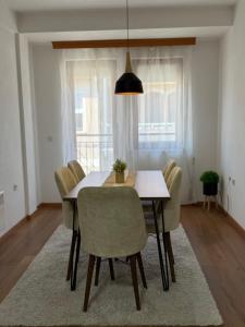 a dining room with a table and chairs at Eva apartment in Ohrid