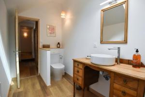 a bathroom with a sink and a toilet at Chez Marcel et Louise in Chinon +38 photos
