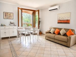 a living room with a couch and a table at Villa Porpora Luxury Design in Modena