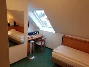 Postel nebo postele na pokoji v ubytování Hotel Zur Mühle