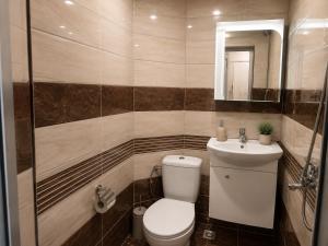 a bathroom with a toilet and a sink at City Centre Room Near Everything in Varna City