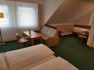 Postel nebo postele na pokoji v ubytování Hotel Zur Mühle