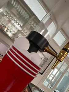 a red lamp with white hearts on it at Kattohuoneisto antinkatu in Pori +17 photos