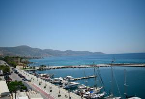 a group of boats docked at a marina at Hotel ALS KARYSTOS in Karistos +13 photos
