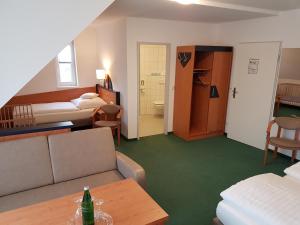 Postel nebo postele na pokoji v ubytování Hotel Zur Mühle