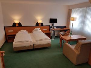 Postel nebo postele na pokoji v ubytování Hotel Zur Mühle