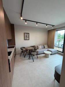 a living room with a couch and a table at MJ Apartments in Łomża