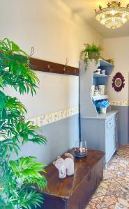 a room with a table with an elephant statue on it at Casa da Juana in Chantada +29 photos