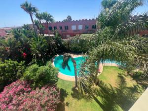 an overhead view of a swimming pool in a garden at Chic Villa - Pool - Wi-Fi -Parking - 3 Bedrooms in Sidi Bouzid