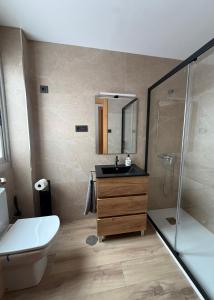 a bathroom with a sink and a shower at Zapillo 2&1 in Almería